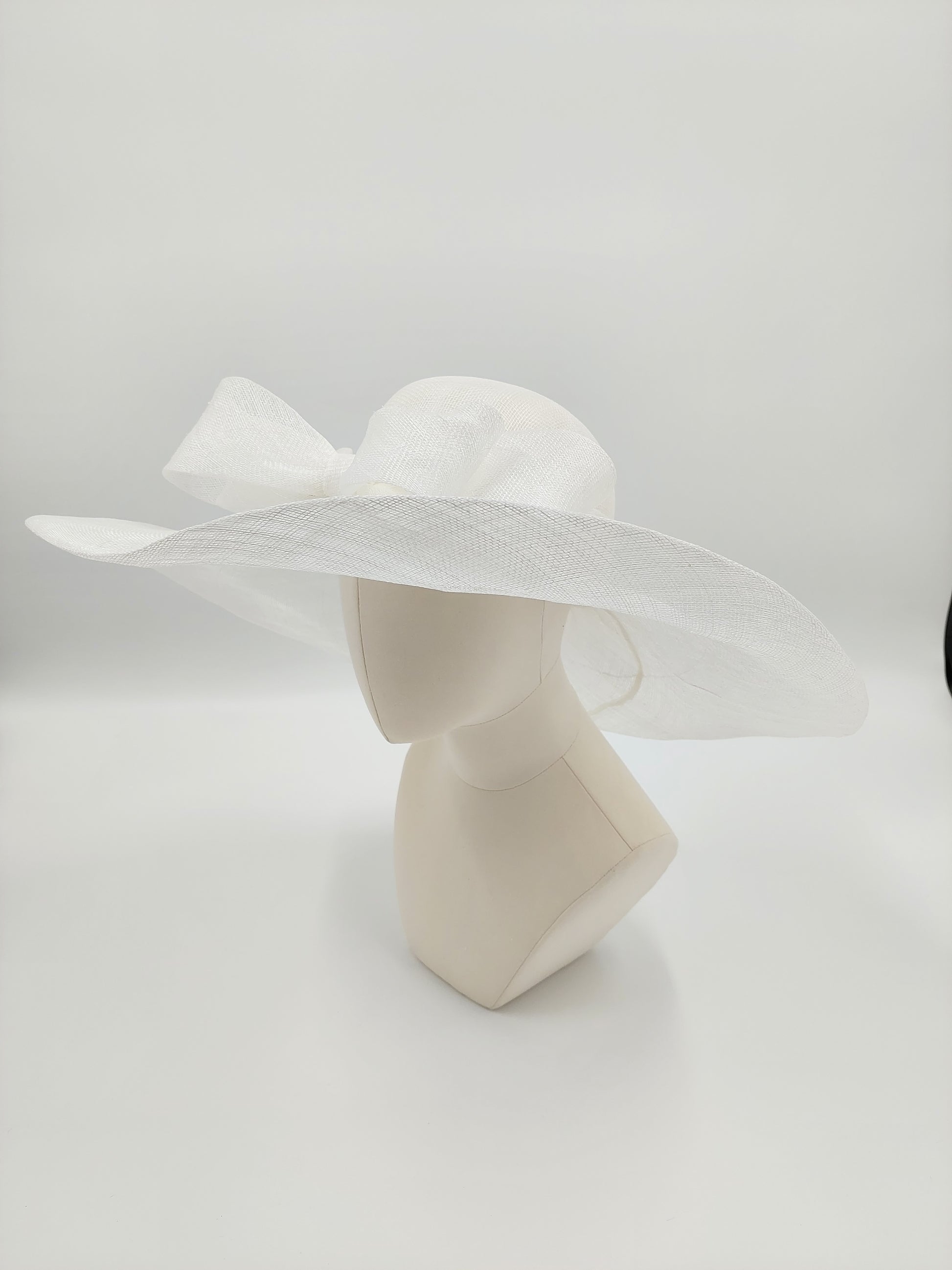 Hat Haven Millinery hat store in Louisville Kentucky, custom hat maker, miller, ladies dress hats, wedding hats, Kentucky Derby hats, fascinators, hatinators, men's hats, hat bands, Ascot hats, fashion on the field, race day hats.