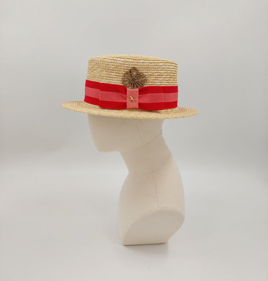 Men's boater in natural toyo straw. Finished with a grey and coral petersham ribbon imported from England. Accented with a gold horse pin. 57cm.