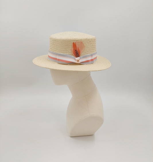 Men's boater in natural toyo straw. Finished with a grey and coral petersham ribbon imported from England. Accented with a gold horse pin. 57cm.