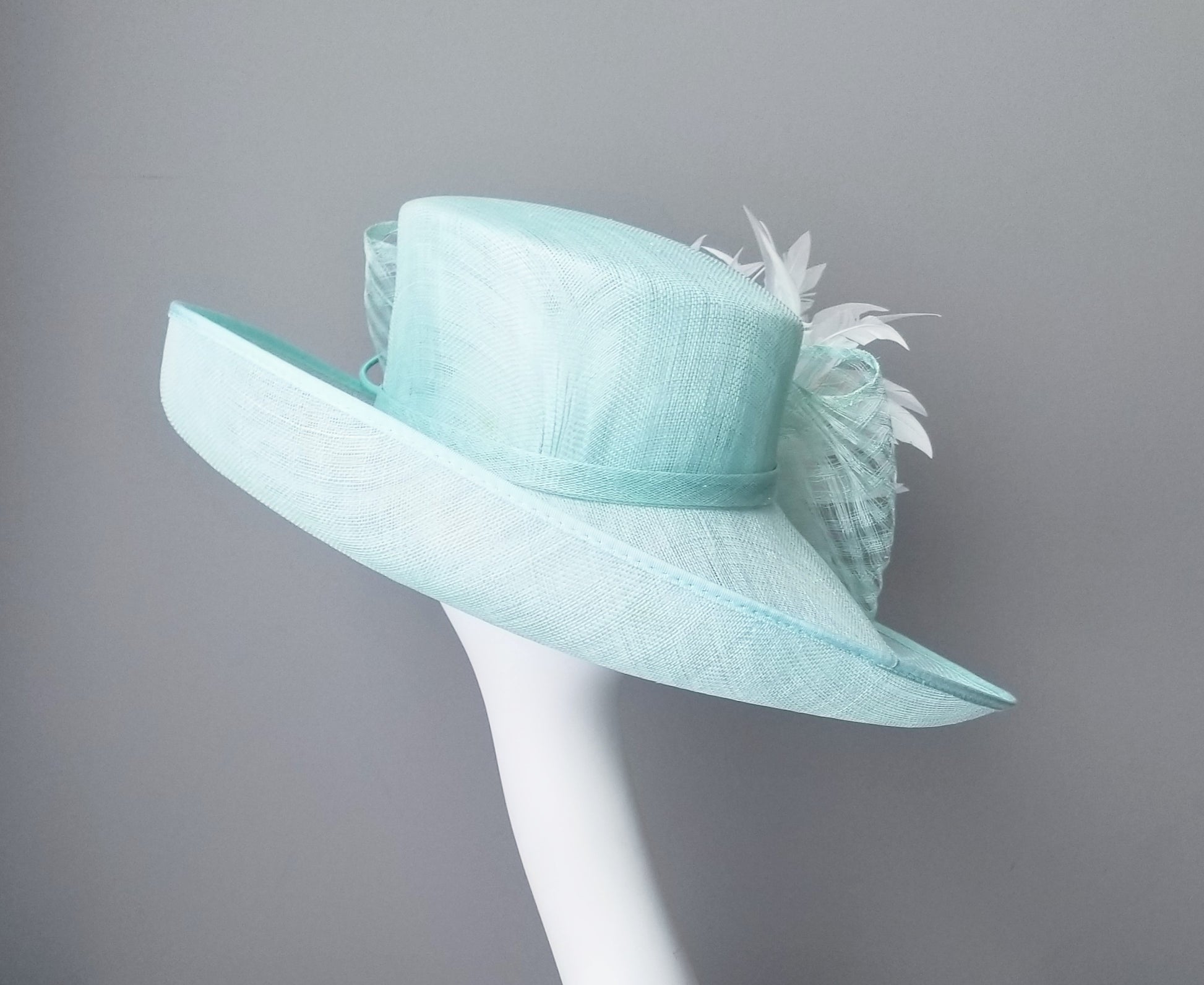 Hat Haven millinery hat shop in Louisville, Kentucky. Custom hats, Kentucky Derby hats, ladies dress hats, fascinators, hatinators, wedding hats, mother of the bride hats, bridal head pieces, men's hats, boutonnieres, custom millinery hat maker, Ascot hats, Melbourne Cup hats, race day hats.